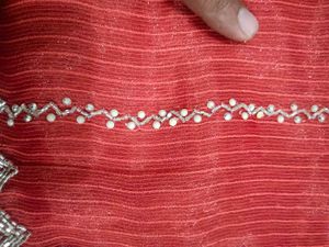Stunning Coral Saree with Silver Embellishments