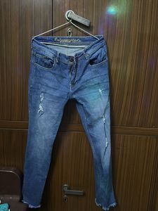 Distressed Blue Denim Jeans