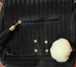 Chic Black Crossbody Bag with Pom Po