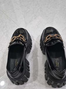 Chic Black Patent Loafers with Gold Chain Accent