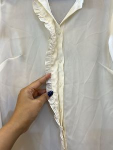 Elegant Cream Top with Metal Detail