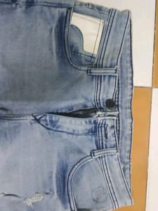 Light Wash Distressed Denim Jeans