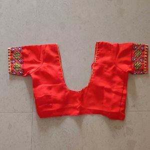Vibrant Orange Embroidered Saree