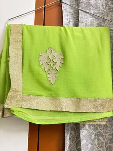 Vibrant Green Saree with Golden Border