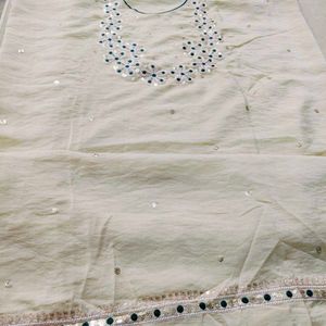 Elegant Cream  dress material with Green Bandhani