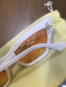 White Cat-Eye Sunglasses with Orange Lenses