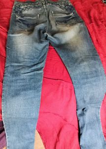 Distressed Blue Denim Jeans
