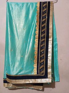 Stunning Teal Saree with Gold Border