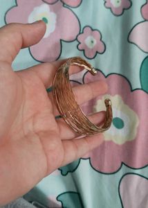 Elegant Gold Tone Twisted Bangle