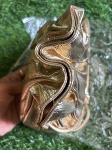 Estee Lauder Glamorous Gold Potli  Bag