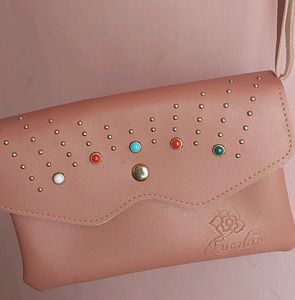 Peach Colour Sling Bag With 2 zips Can Carry Mobile ,wallet Cards And Make Up Items.