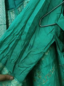 Elegant Green Saree with Gold Floral Print