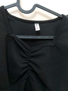 black crop top with bell sleeves