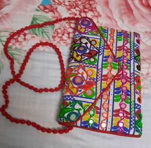 Combo Of Embroidered Sling Bag And  Zari  Potli