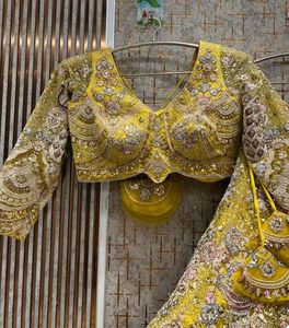Stunning Yellow Peacock Embroidered Lehenga Choli