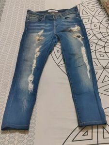 Distressed Blue Denim Jeans