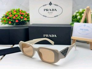 Prada Sunglasses - Chic Pink Tinted Lenses