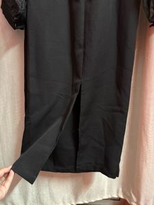 Elegant Black Dress with Sheer Sleeves