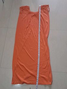 Elegant Orange Gown with Smocked Neckline
