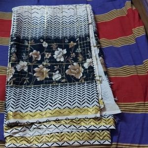 beautiful checked cream saree with black print border