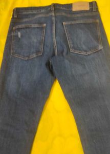 Distressed Blue Denim Jeans