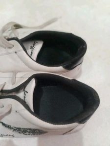 White Sneakers with Feather Design
