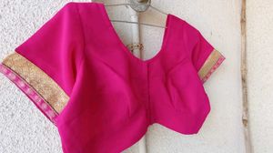 Elegant Pink Blouse with Gold Trim