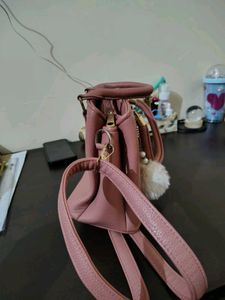 Stylish Pink Textured Handbag with Charm