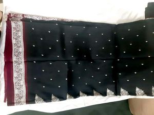 Elegant Black Saree with Intricate Borders