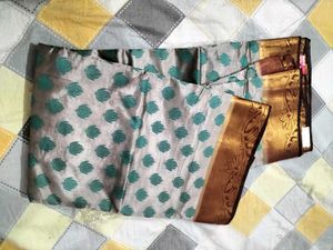 Elegant Silk Saree with Teal Motifs