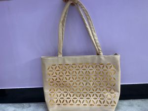 Stylish Beige Tote Bag with Cutout Design