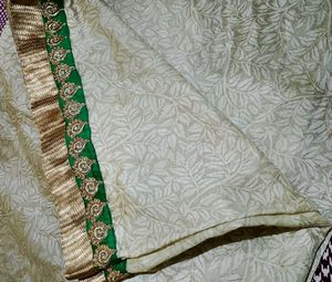 Grand Cream Saree with Green-Golden border