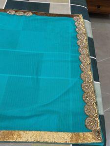 Beautiful Teal Blue Saree with Gold Border