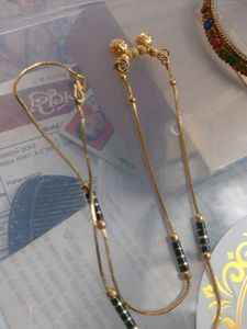 offer r Gold Chain with Black Bead