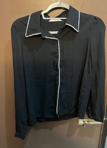 Chic Black Blouse with White Trim