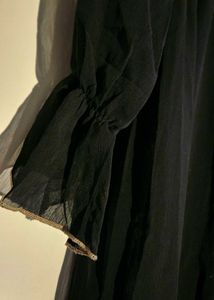 Black Abaya with Cream-colored Ruffle Trim