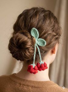 Crocheted Hair Accessory with Pom Poms