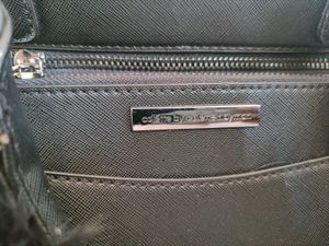 Stylish Black Handbag with Fur Pom-Pom