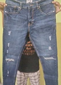 Distressed Blue Denim Jeans