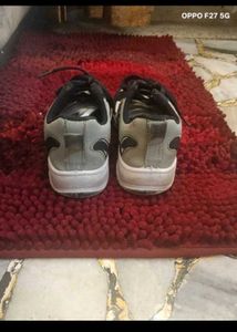 7. BOYs Black and White Sneakers
