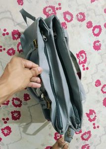 Stylish Grey Tote Bag with Pom-Pom Accent