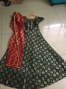Silk green colour Anarkali salwar with red colour Shawl.Used only once good condition