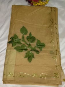 Elegant Beige Saree with Green Floral Embroidery