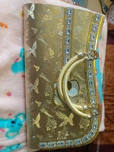 Elegant Gold Clutch with Bird Motif