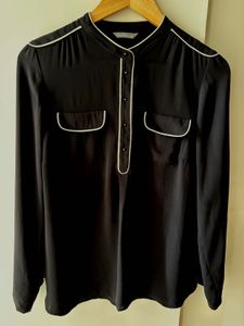 Chic Black Top with White Piping