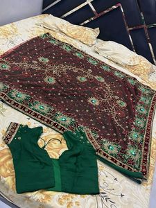 Elegant designer heavy work green  georgette saree