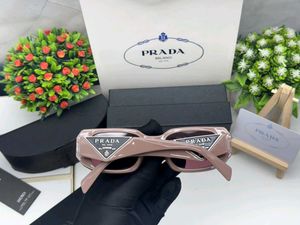 Prada Sunglasses - Chic Pink Tinted Lenses