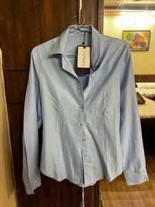 Light Blue Button-Down Shirt ( size - M)
