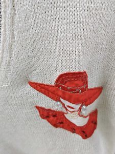 Chic White Knit Top with Lady Detail