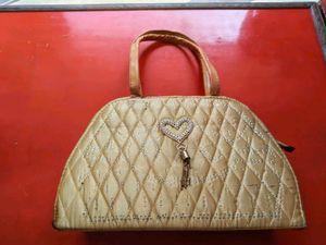 Quilted Beaded Handbag with Heart Charm